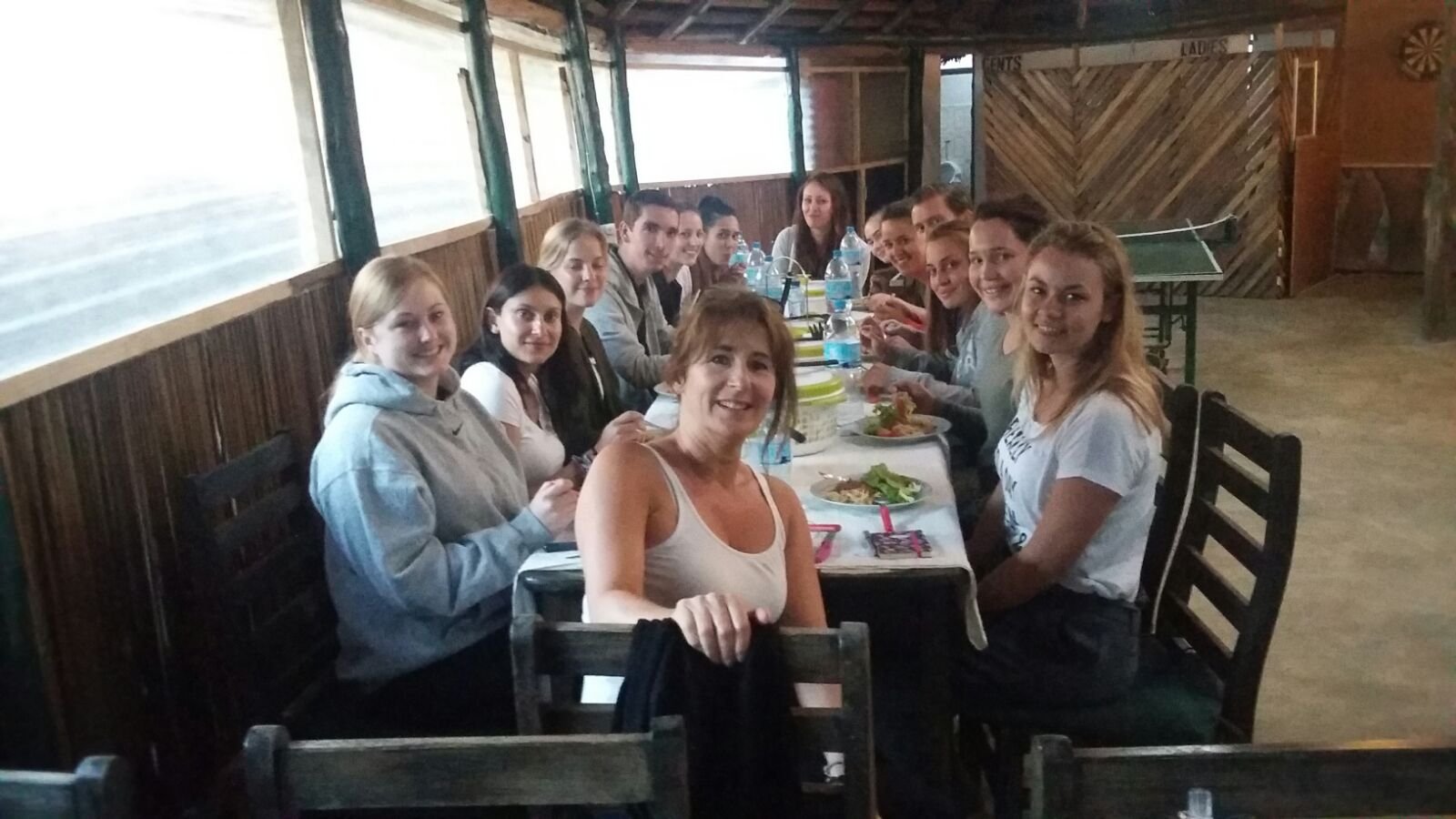 Volunteers enjoying dinner together at the lodge